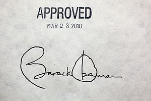 President Barack Obama's signature on the heal... President Barack Obama's signature on the heal...