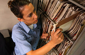 A medical record folder being pulled from the ... A medical record folder being pulled from the ...